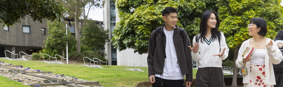 Deakin international students walk through Burwood Campus.
