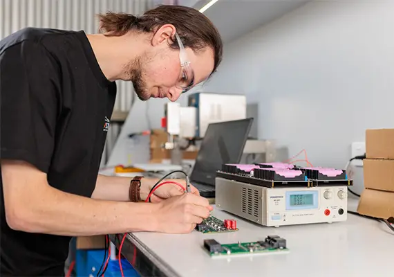 Deakin engineering student Zach Harvey working on electrics