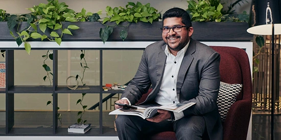 Man smiling at camera in the Deakin Downtown CBD building.