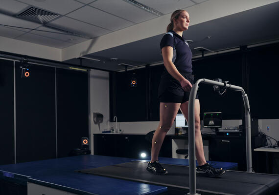 Woman walking on a gait analysis machine.