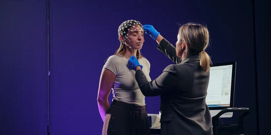 Deakin psychology student using an EEG machine.