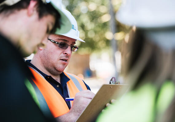 Two construction managers talking to each other