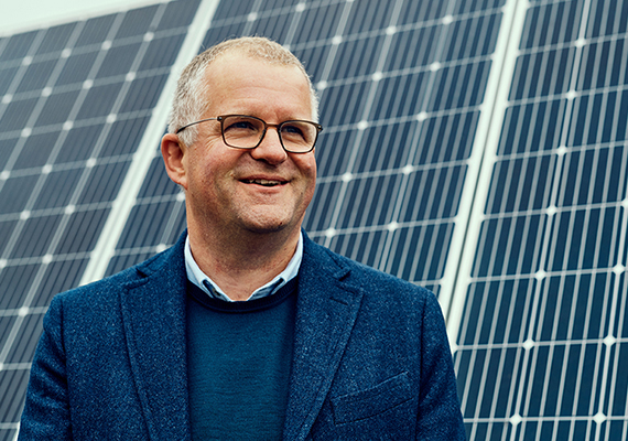 Vice-chancellor Iain martin standing and smiling.