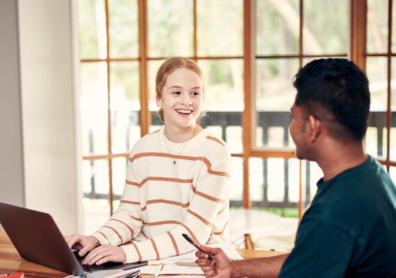 Two students collaborating on VTAC course preferences and university applications at home.