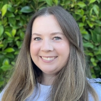A headshot of Millie Sedlarevic smiling at the camera.