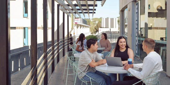 Students studying at a cafe on the Melbourne Burwood Campus.