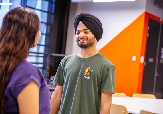 A Deakin international student chatting to a Deakin authorised agent about studying in Australia.