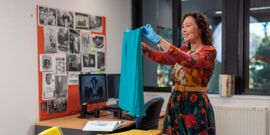 A researcher holding a piece of fabric. 