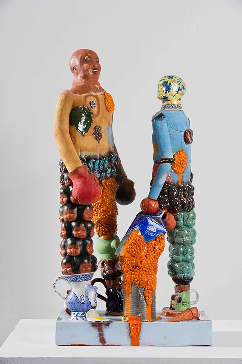 Colourful sculpture of two people 