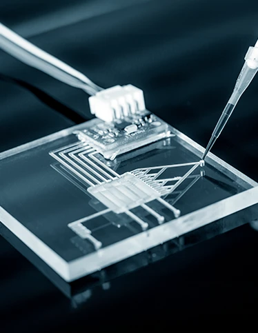 Nanotubes on a chip being worked on with a metal utensil.