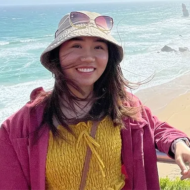 Person standing near ocean