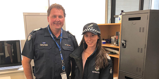 550x275_olga Olga Chatzigiannis with a police officer in uniform.