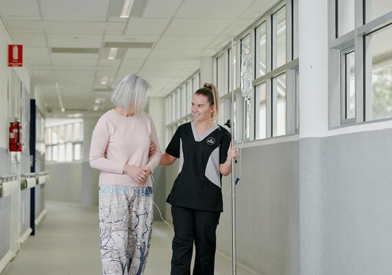 Nursing student helping elderly