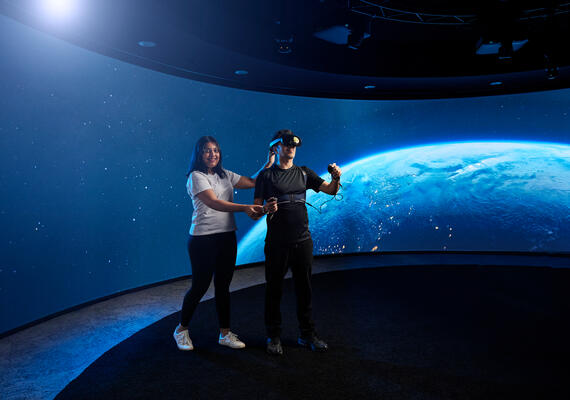 Researcher and subject in technology lab