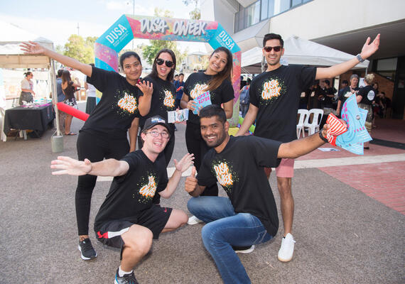 Group of deakin students from the deakin university student association smiling on campus.