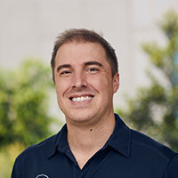 A headshot of Luke Ridgwell smiling at the camera.