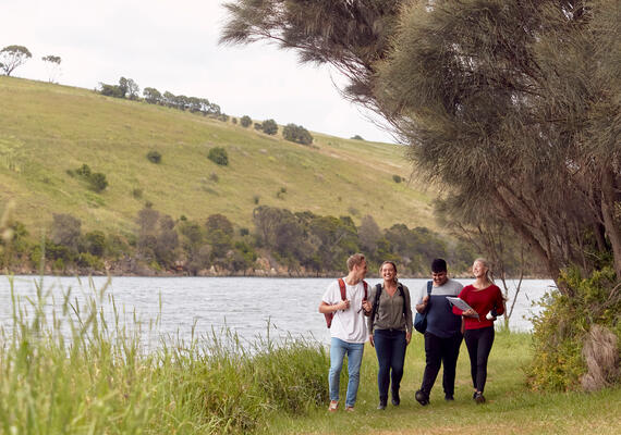 Deakin Warrnambool students walking near the river that runs through campus