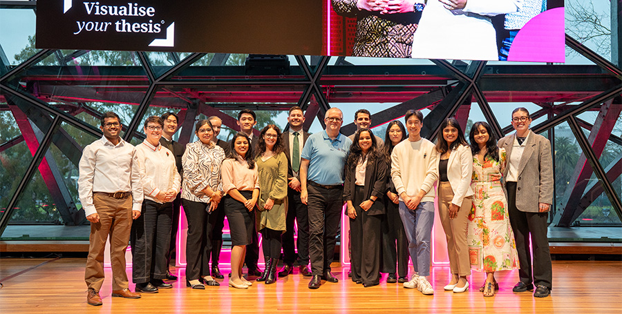 Deakin's 16 finalists for the 2025 3MT/VYT competitions with the Vice Chancellor