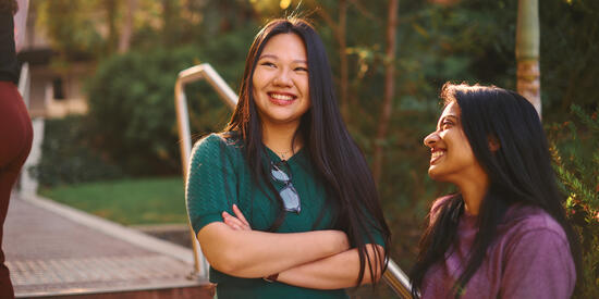 Two students smiling at Burwood campus.