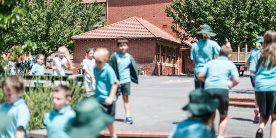 Primary school children playing outdoors.