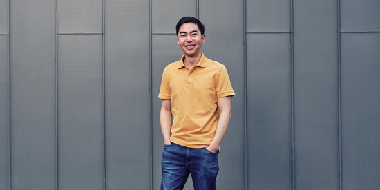 Postgraduate one-year masters degree student outside Law School Building at Deakin's Melbourne Burwood Campus.