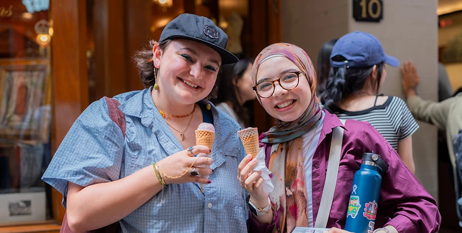 Two International Summer School students enjoying ice cream while exploring Melbourne's city centre.