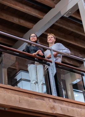 Students standing on balcony 