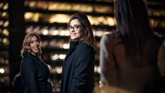 MBA students outside city building at night