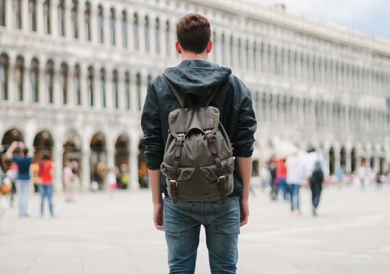 Traveller with backpack in Venice, Italy.