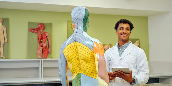 Deakin medical science student in clinical setting.