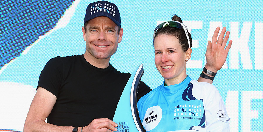 Cyclist Cadel Evans smiling with a Deakin University cyclist competing in the Cadel Evans Great Ocean Road Race.
