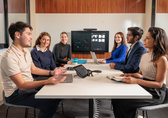A group of six Deakin business and commerce students at a table