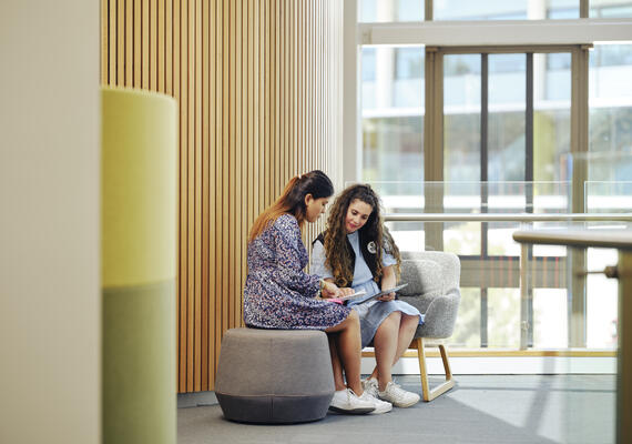 Staff interacting and assisting a student one-on-one on the Burwood campus.