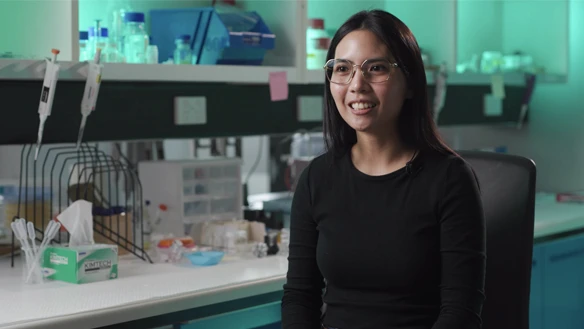 Deakin engineering research student Mia talking and smiling in a campus lab.
