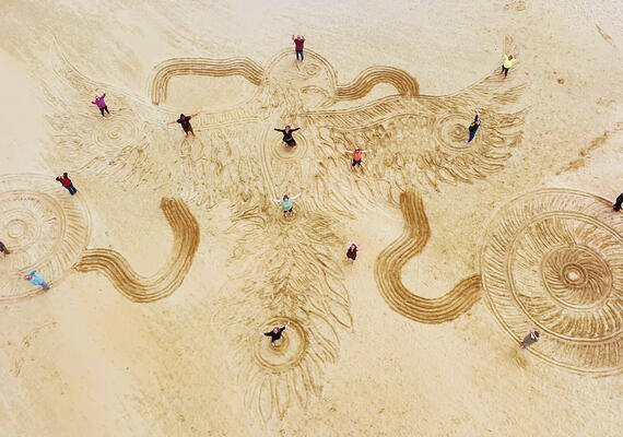 Looking down to beach and team from Centre for Regenerating Futures.