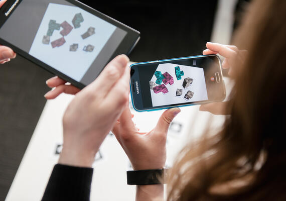 Close up of hands holding mobile phones