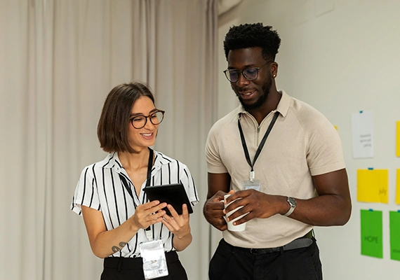 Two medical students looking at a tablet.