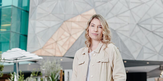Student standing in Federation Square in Melbourne.