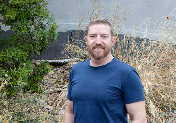Garrath Cockerell, who transferred to Deakin, is standing on campus.