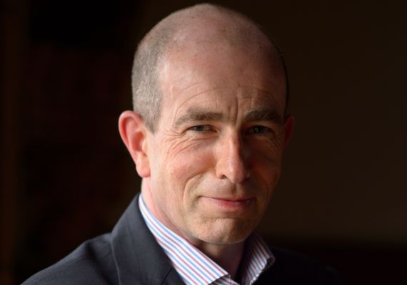 Executive Dean Simon Tormey in front of a dark background