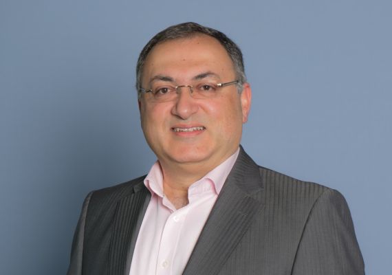 Professor Shahram Akbarzadeh smiling to camera