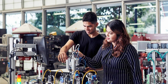 Students working on electronic wires.