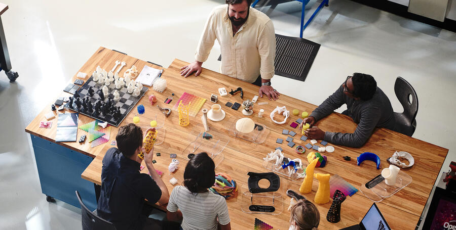 Students reviewing 3D printed objects