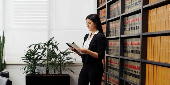 Deakin law student researches in Victorian Bar Association library/meeting room.
