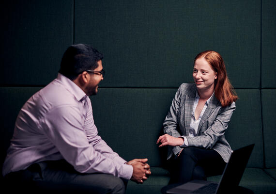 Two professionals have a consultation. 