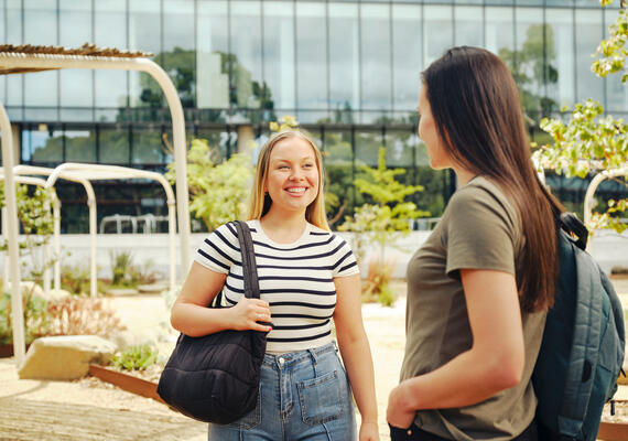 Two students interacting at the Burwood Campus.