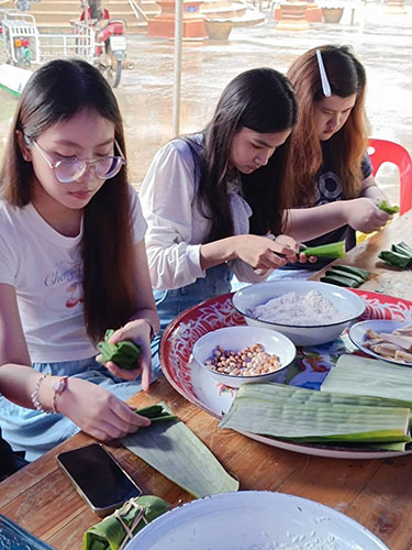 Annabel participating in a Thai cooking workshop