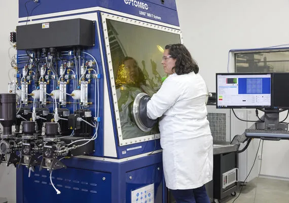 A researcher in Deakin's Institute for Frontier Materials using a machine
