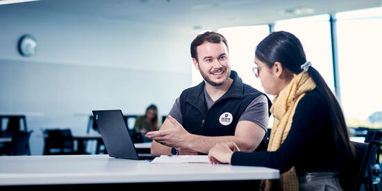 A Deakin staff member in discussion with prospective employee