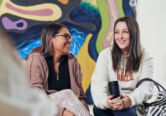 Staff and students chatting